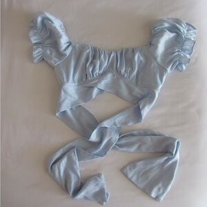 Women's Light Blue Ruffled Crop Top with Tie up back. Size small